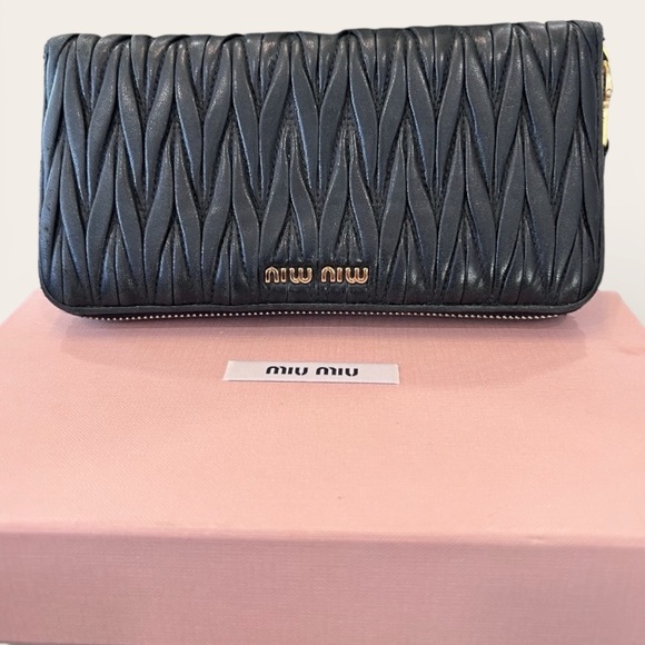 Miu Miu Handbags - Miu Miu
 Black Matelasse Leather Zip Around Wallet